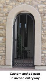 custom arched gate in arched entryway.