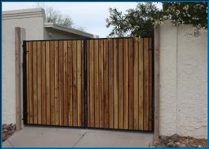 RV Gate: Picutre of double iron/wood drive gate to a back yard.
