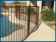 Pool fence:  picture of custom pool fence with curves panels.